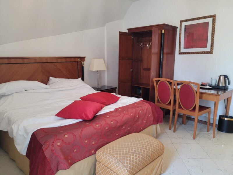 Spacious double room with historic windows at Hotel Leon D'Oro Prague