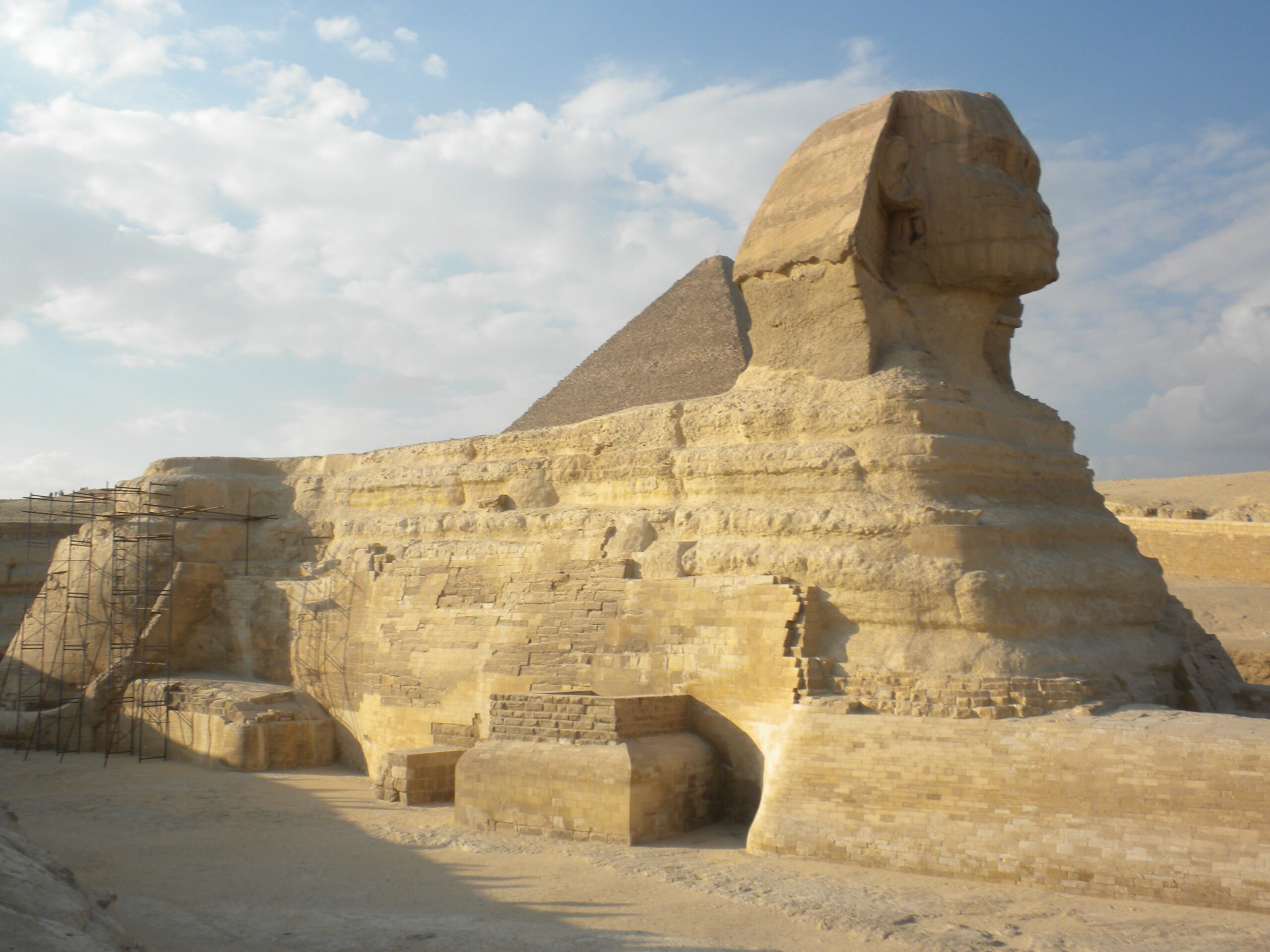 The Sphinx with Khufu's Pyramid in the background.