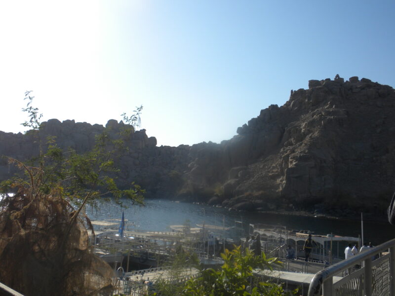 Rugged cliffs surround the Philae Temple Complex in Aswan.